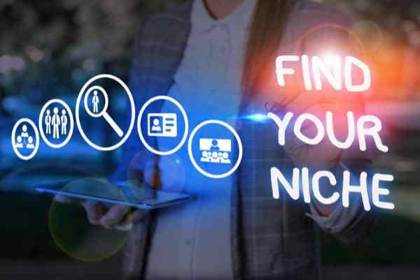 Conceptual hand writing showing Find Your Niche. Man holding a tablet with images for search, email, presentations, business and social media