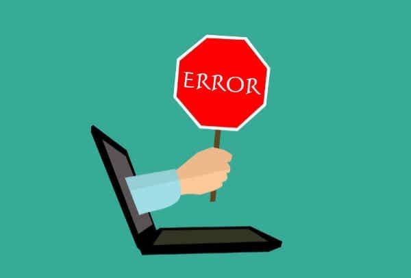 Error graphic with a stop sign coming out of a computer screen.